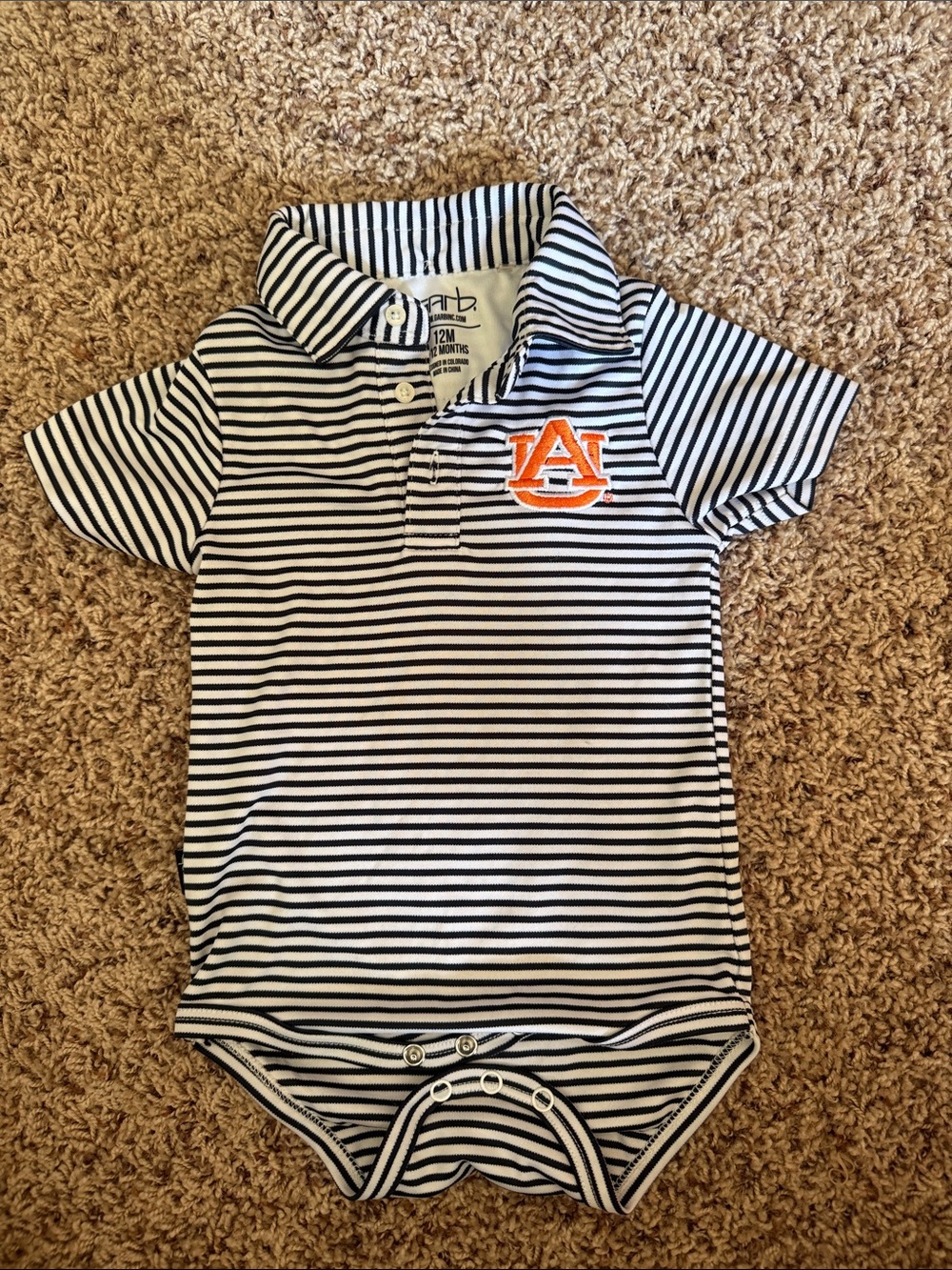 Auburn White Polo baby Oneise with Orange Logo